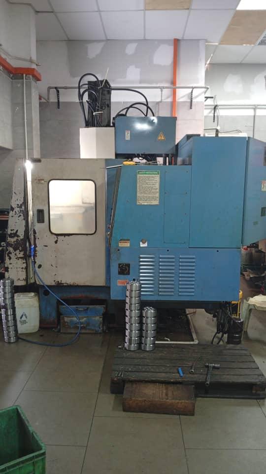 CNC turning cell with machined coupler output